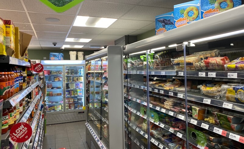 aisles of food and refrigerators in supermarket food shopping in Arisaig