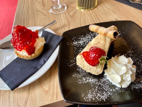 cakes at sound bites cafe Arisaig Scotland, strawberry tart and Orkney Fudge Cheesecake