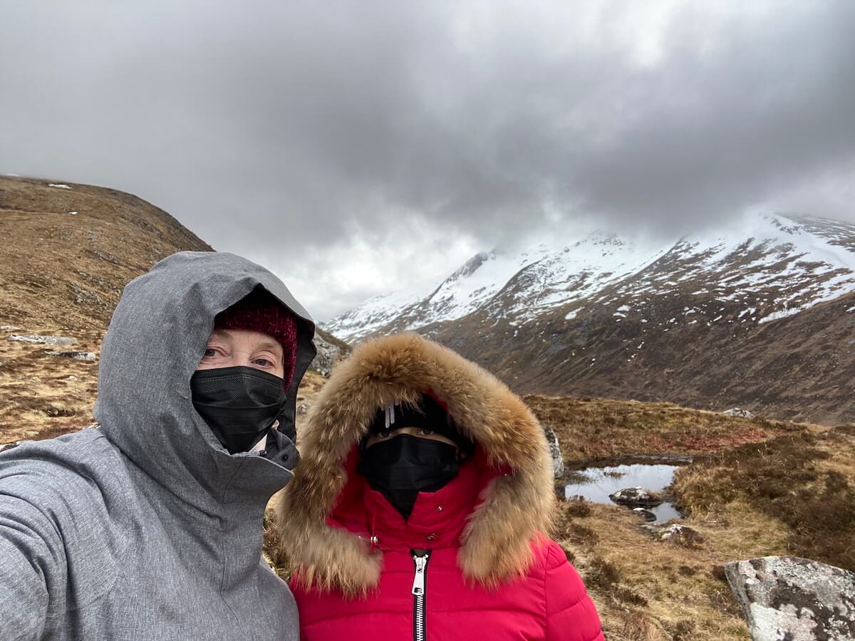 Author and daughter in warm winter clothes with Ben Nevis in background